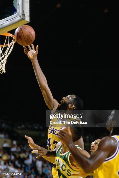 James Worthy, Small Forward and Power Forward for the Los Angeles Lakers drives to the basket to make a layup shot during the NBA Pacific Division...