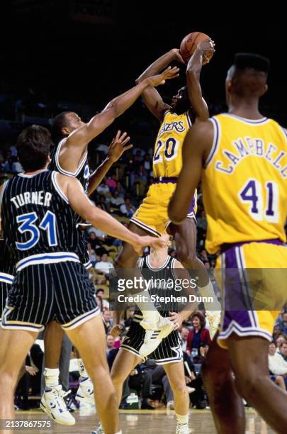Terry Teagle, Shooting Guard and Small Forward for the Los Angeles Lakers rises to make a jump shot to the basket during the NBA Pacific Division...