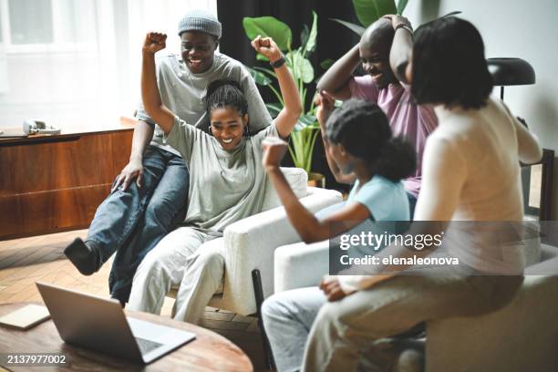 group of friends watching a championship or a movie on a laptop - group video conference stock pictures, royalty-free photos & images