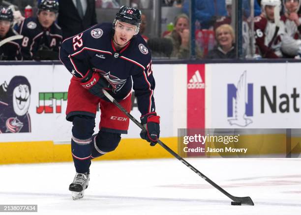 Jake Bean of the Columbus Blue Jackets skates with the puck during the second period against the Colorado Avalanche at Nationwide Arena on April 01,...