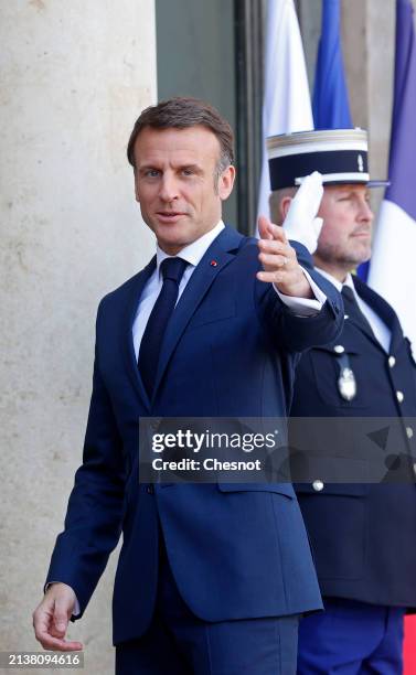 French President Emmanuel Macron gestures as he welcomes Austria's Chancellor Karl Nehammer prior to a working lunch at the Elysee on April 04, 2024...