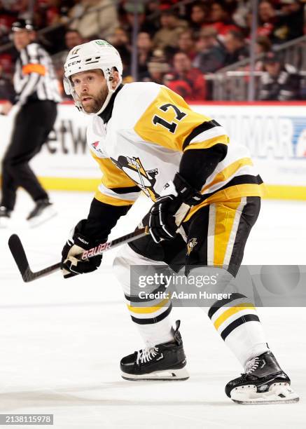Bryan Rust of the Pittsburgh Penguins skates against the New Jersey Devils during the first period at the Prudential Center on April 2, 2024 in...