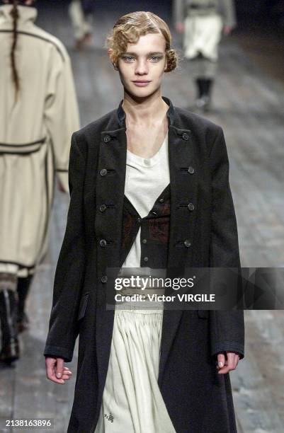 Natalia Vodianova walks the runway during the Dries Van Noten Ready to Wear Fall/Winter 2002-2003 fashion show as part of the Paris Fashion Week on...