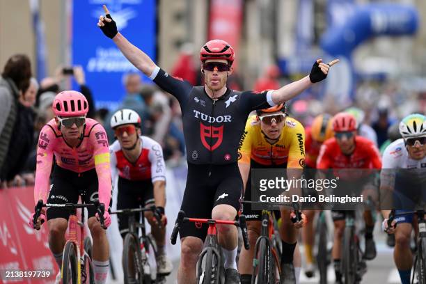 Alberto Dainese of Italy and Tudor Pro Cycling Team celebrates at finish line as stage winner ahead of Marijn van den Berg of The Netherlands and...