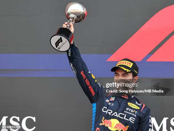 Sergio Perez of Mexico and Oracle Red Bull Racing celebrates his second place finish on the podium during the F1 Grand Prix of Japan at Suzuka...