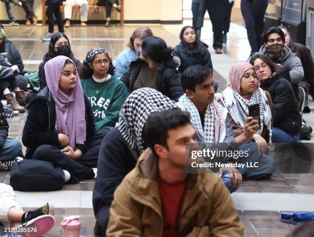 Pro-Palestine students protesters hold a peaceful rally while sitting on the floor of the Administrative building at the State University of New York...