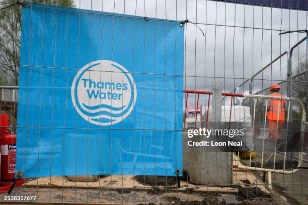 The Thames Water logo is seen on protective fencing around a pipework replacement site on April 04, 2024 in London, England. Last week, Thames Water...