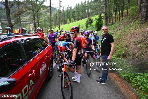 Michal Kwiatkowski of Poland and Team INEOS Grenadiers, Kiko Garcia of Spain Race Director and a general view of the peloton waiting after the...