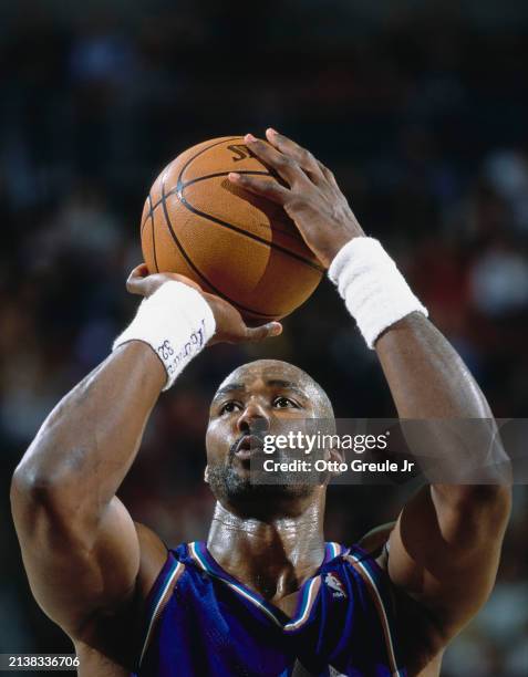 Karl Malone, Power Forward for the Utah Jazz prepares to shoot a free throw during the NBA Pacific Division basketball game against the Seattle...