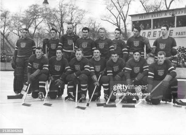 Portrait of the members of the 1948 US Olympic hockey team as they pose on an ice rink, St Moritz, Switzerland, 1948.