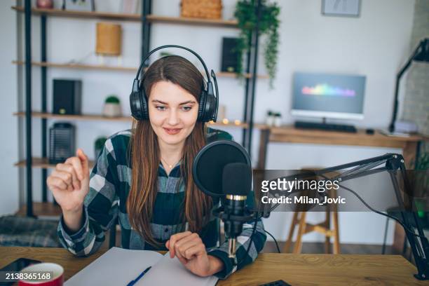 influencer making podcast from home studio - news stock pictures, royalty-free photos & images