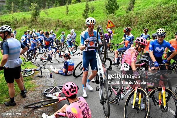 Gijs Leemreize of The Netherlands and Team dsm-firmenich PostNL and a general view of the peloton waiting at Olaeta after the neutralisation of the...