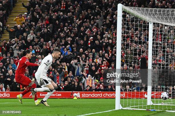 Darwin Nunez of Liverpool scores the opening goal during the Premier League match between Liverpool FC and Sheffield United at Anfield on April 04,...