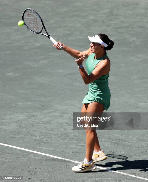 Jessica Pegula of the United States returns a shot to Magda Linette of Poland on Day 4 of the WTA Tour at Credit One Stadium on April 04, 2024 in...