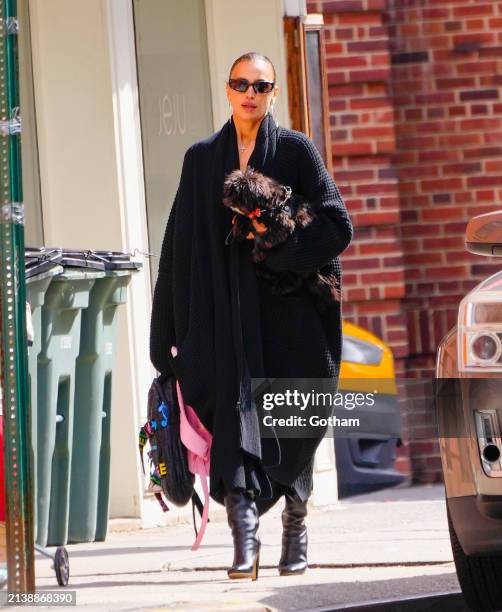 Irina Shayk is seen with her dog on April 04, 2024 in New York City.