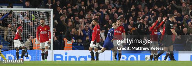 Aaron Wan-Bissaka, Bruno Fernandes, Casemiro, Harry Maguire, Diogo Dalot of Manchester United react to conceding a goal to Conor Gallagher of Chelsea...