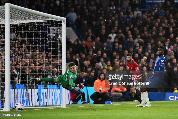Bruno Fernandes of Manchester United scores his team's second goal as Djordje Petrovic of Chelsea looks on after failing to make a save during the...