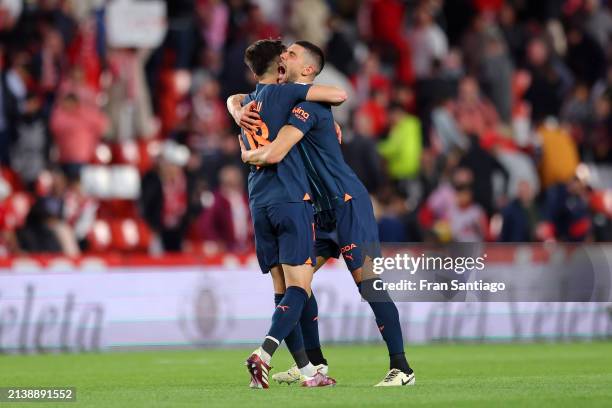 Pepelu of Valencia CF celebrates with teammate Cenk Ozkacar during the LaLiga EA Sports match between Granada CF and Valencia CF at Estadio Nuevo Los...