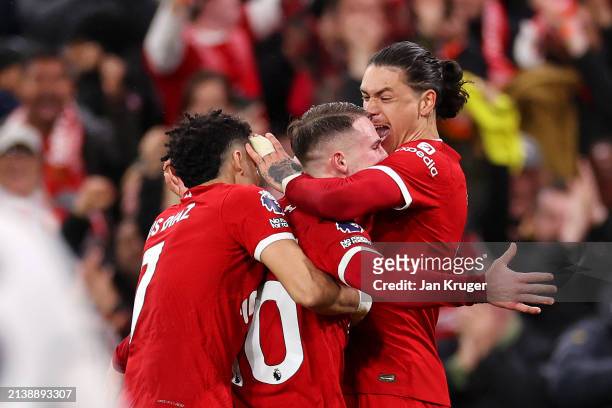 Alexis Mac Allister of Liverpool celebrates scoring his team's second goal with teammates Luis Diaz and Darwin Nunez during the Premier League match...