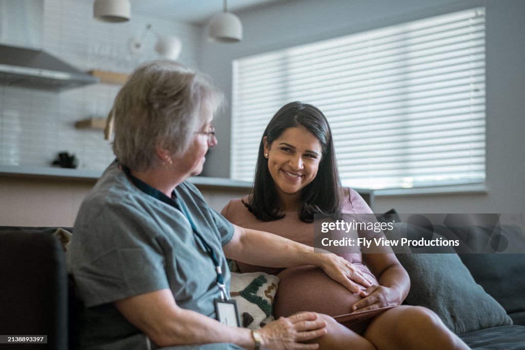 Multiracial pregnant woman having a check-in with her doctor