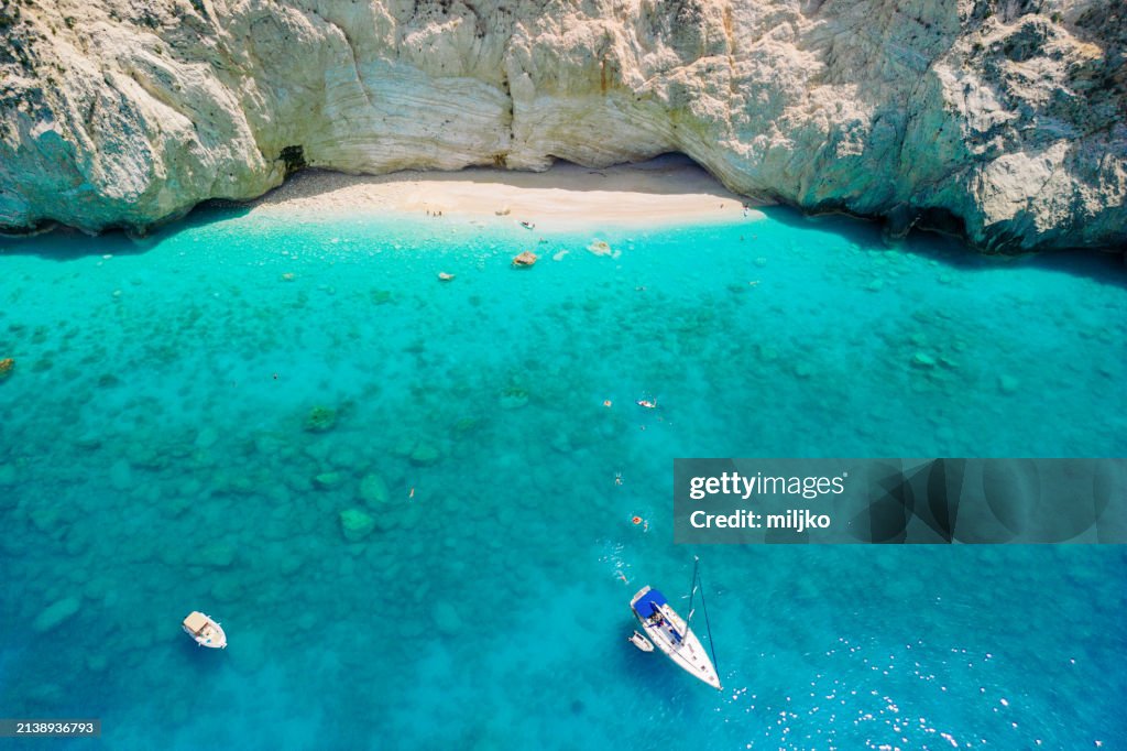 Friends relaxing in amazing water on Ionian sea
