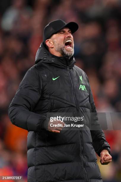 Jurgen Klopp, Manager of Liverpool, celebrates victory in front of fans of Liverpool after the Premier League match between Liverpool FC and...