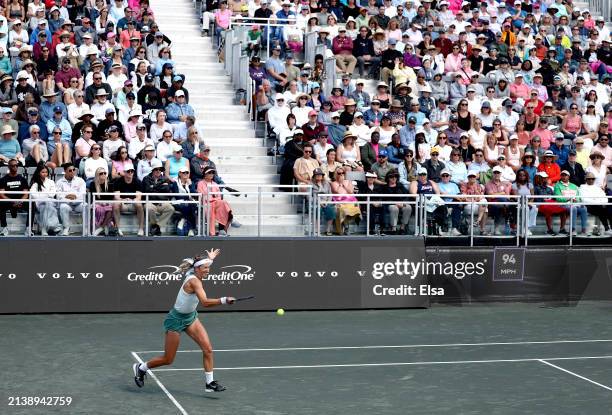 Victoria Azarenka of Belarus returns a shot to Taylor Townsend of the United States in the first set on Day 4 of the WTA Tour at Credit One Stadium...