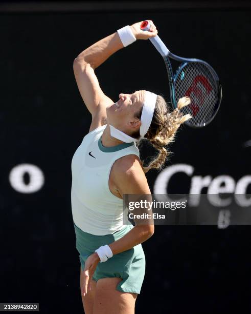 Victoria Azarenka of Belarus serves the ball to Taylor Townsend of the United States in the first set on Day 4 of the WTA Tour at Credit One Stadium...