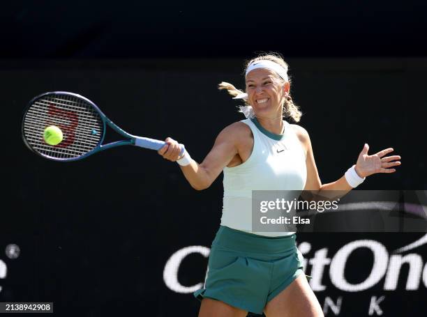Victoria Azarenka of Belarus returns a shot to Taylor Townsend of the United States in the first set on Day 4 of the WTA Tour at Credit One Stadium...