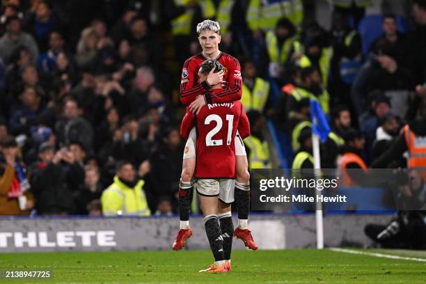 Alejandro Garnacho of Manchester United celebrates scoring his team's third goal with teammate Antony during the Premier League match between Chelsea...