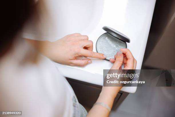 woman's hand holding invisible aligners. - aparelho dentário imagens e fotografias de stock