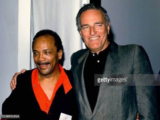 American record producer Quincy Jones and Co-Founder of A&M Records Jerry Moss pose for a portrait in Los Angeles, California, circa 1990.