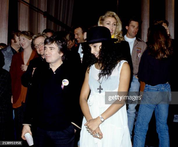 Part of a group of over 100 celebrities sing during a playback of their recorded song 'Voices That Care' at Warner Brothers Studios in Burbank,...