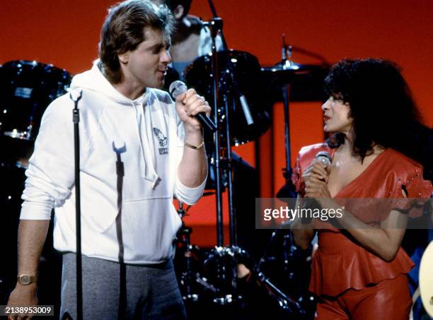 American singers Eddie Money and singer Ronnie Spector sing on stage during a concert in Los Angeles, California, circa 1990.