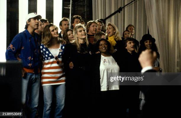 Part of a group of over 100 celebrities sing during a playback of their recorded song Voices That Care at Warner Brothers Studios in Burbank,...