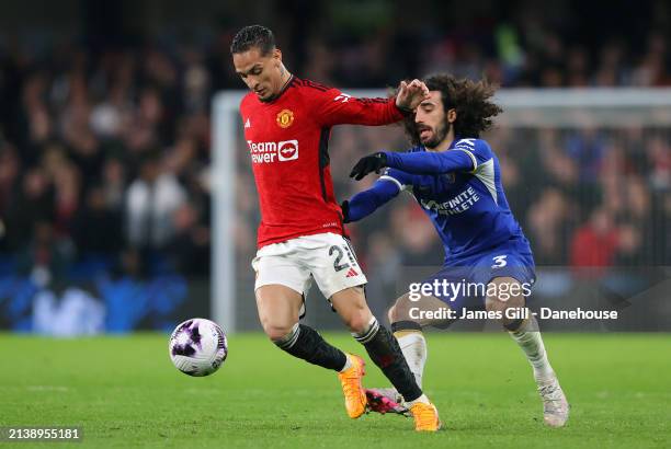 Antony of Manchester United holds off a challenge from Marc Cucurella of Chelsea during the Premier League match between Chelsea FC and Manchester...