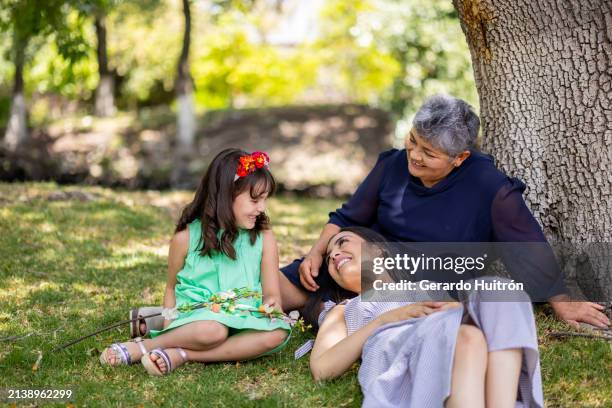 family of three woman in the garden - three storey stock pictures, royalty-free photos & images