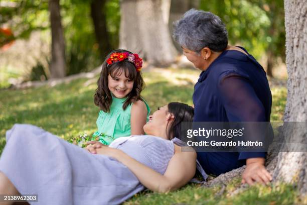 family of three woman in the garden - three storey stock pictures, royalty-free photos & images