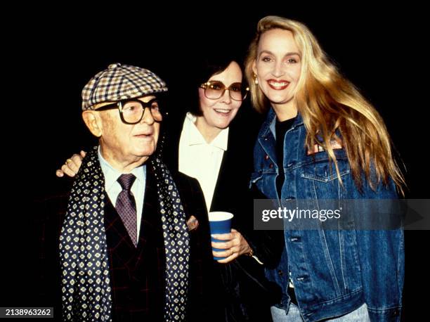 Irving Paul Lazar and his wife Mary Van Nuys pose for a portrait with American model and actress Jerry Hall in Los Angeles, California, circa 1985.