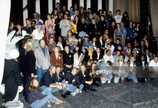 Part of a group of over 100 celebrities sing during a playback of their recorded song 'Voices That Care' at Warner Brothers Studios in Burbank,...