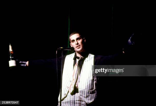 American singer Perry Farrell, of the American rock band Jane's Addiction, sings on stage during a concert in Los Angeles, California, circa 1990.