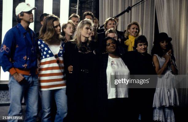 Part of a group of over 100 celebrities sing during a playback of their recorded song 'Voices That Care' at Warner Brothers Studios in Burbank,...