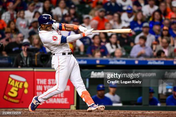 Jeremy Pena of the Houston Astros hits a two run home run against the Toronto Blue Jays at Minute Maid Park on April 03, 2024 in Houston, Texas.
