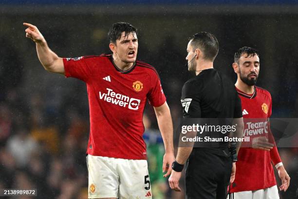 Harry Maguire of Manchester United reacts as he confronts Referee Jarred Gillett, which results in him being shown a yellow card, after the Premier...