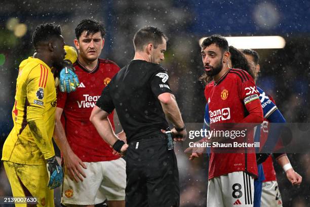 Referee Jarred Gillett is confronted by Bruno Fernandes of Manchester United after the Premier League match between Chelsea FC and Manchester United...