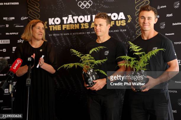 49er sailors Isaac McHardie and Will McKenzie are congratulated by NZOC CEO Nicki Nicol during a Paris 2024 Sailing Selection Announcement at the...