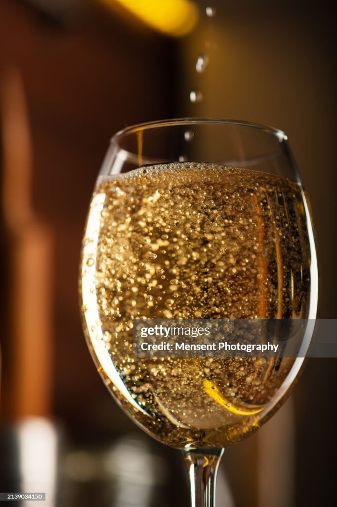 White Wine being poured in to a wine glass close-up