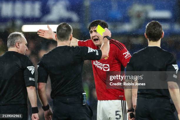 Harry Maguire of Manchester United is booked by Referee Jarred Gillett after his sides 4-3 defeat during the Premier League match between Chelsea FC...