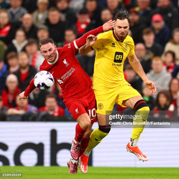 Alexis Mac Allister of Liverpool in action with Ben Brereton Diaz of Sheffield United during the Premier League match between Liverpool FC and...