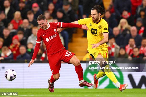 Alexis Mac Allister of Liverpool in action with Ben Brereton Diaz of Sheffield United during the Premier League match between Liverpool FC and...